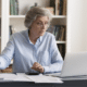 A woman reviewing and calculating taxes