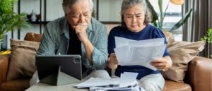 A couple reviewing tax records and tax returns