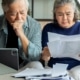 A couple reviewing tax records and tax returns