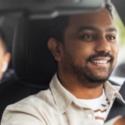 A ride-share driver driving a client
