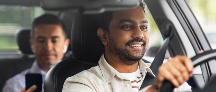 A ride-share driver driving a client